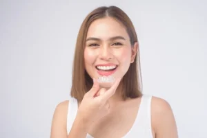 woman showing how one should wear invisalign aligners